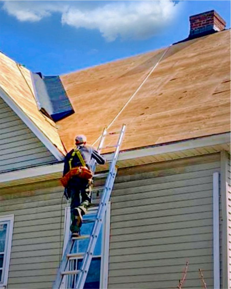 Roofing professional at work